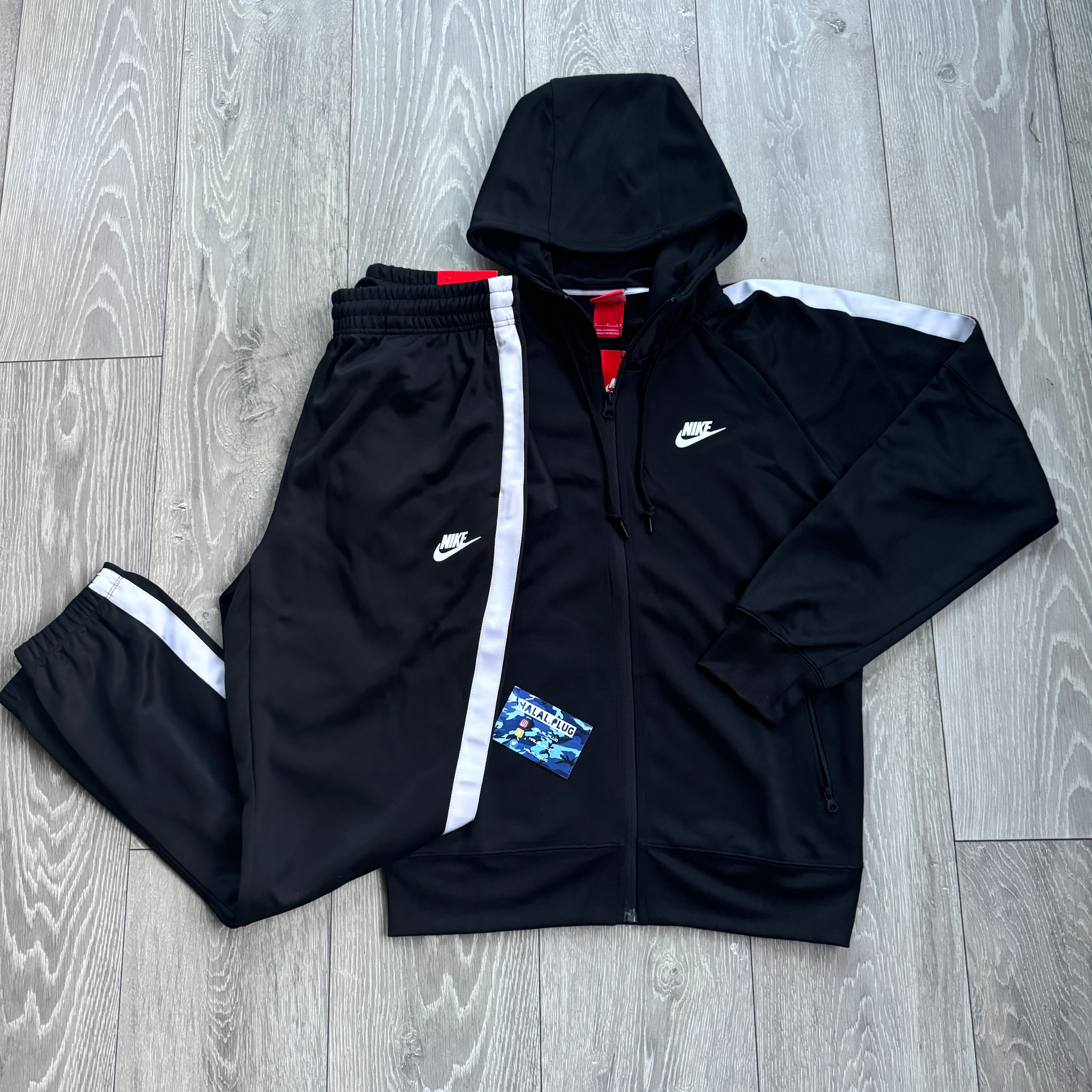 nike tribute tracksuit black and pink